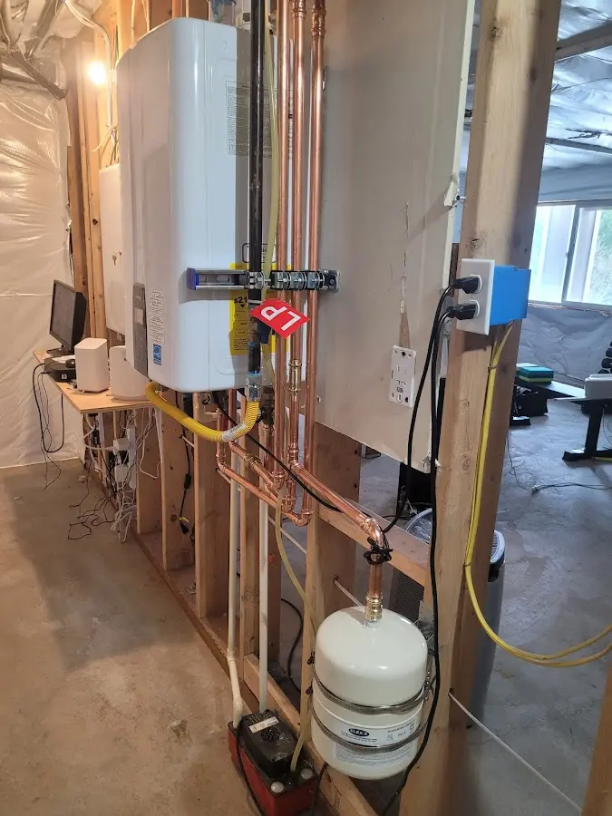 Licensed plumber repairing a kitchen sink in Ada